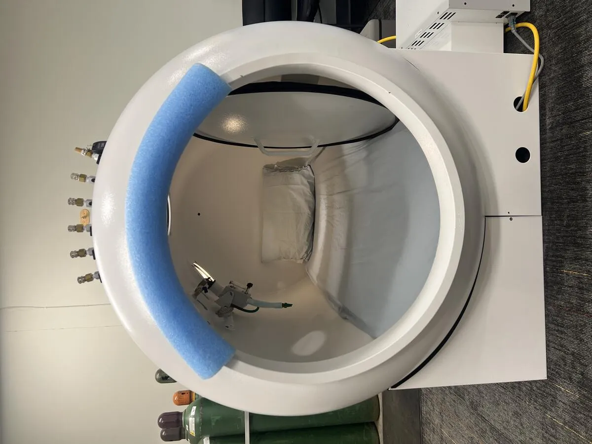White hard-sided hyperbaric oxygen chamber