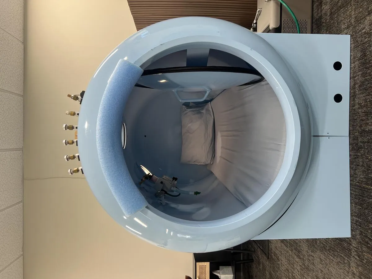 Blue hard-sided hyperbaric oxygen chamber